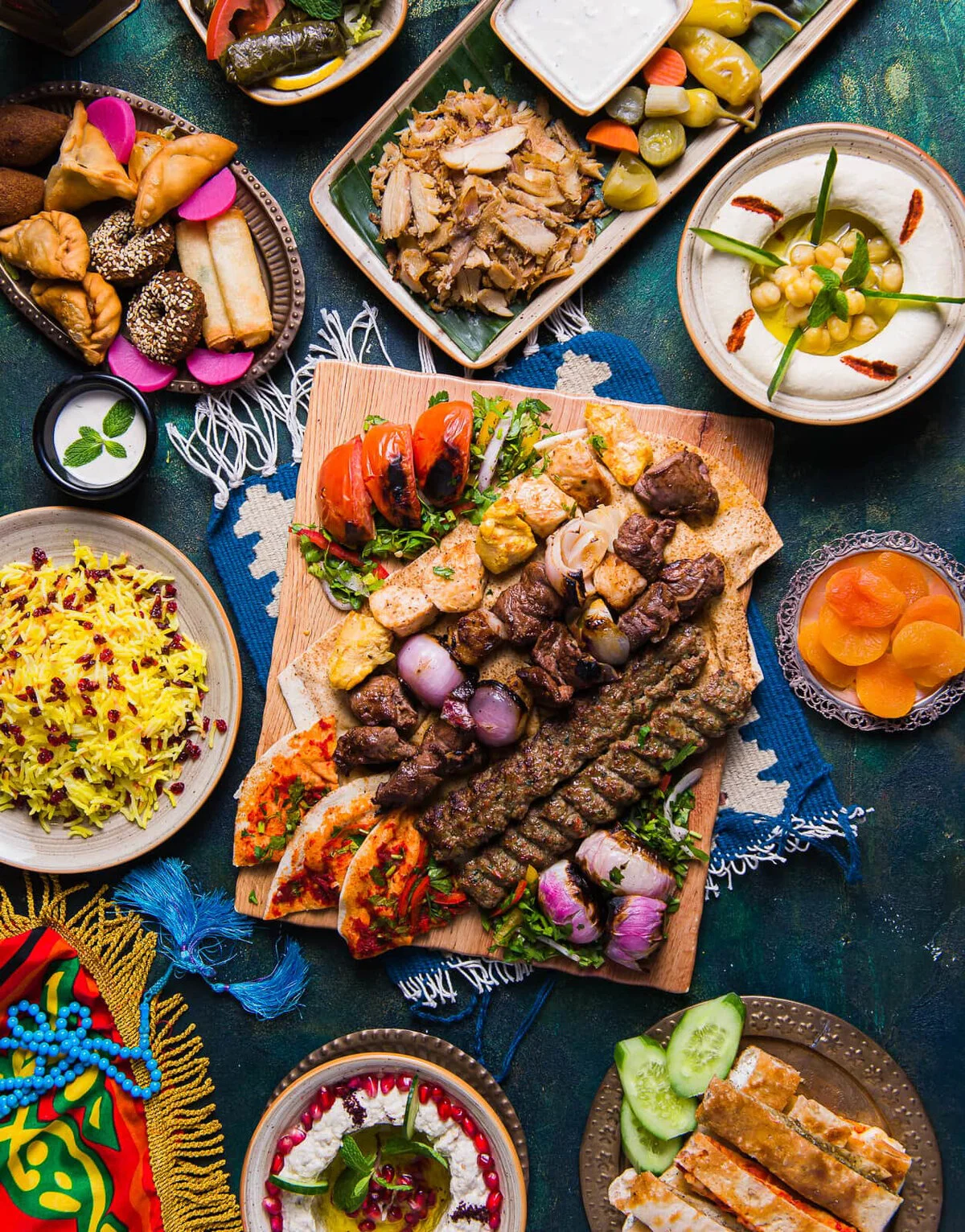 Ramadan feast with mixed grills, rice, hummus and mezze.