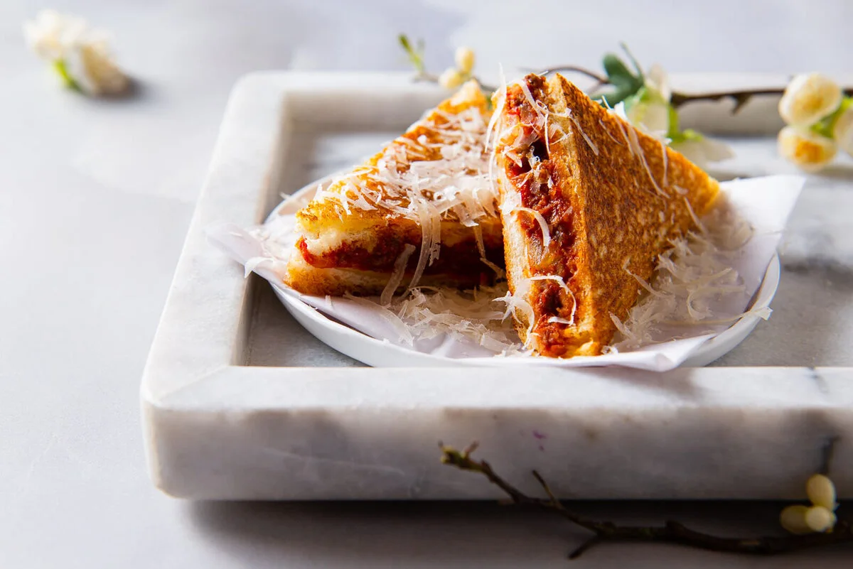 Wagyu and kimchi toastie covered in Parmesan shavings.