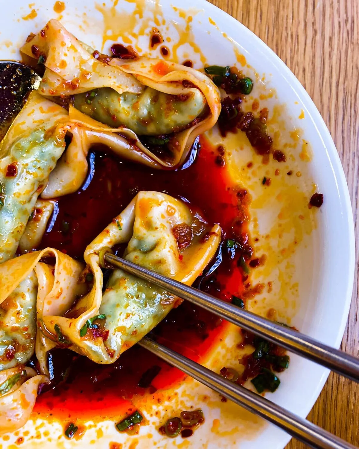 Chicken and shrimp wontons in a dark sauce.