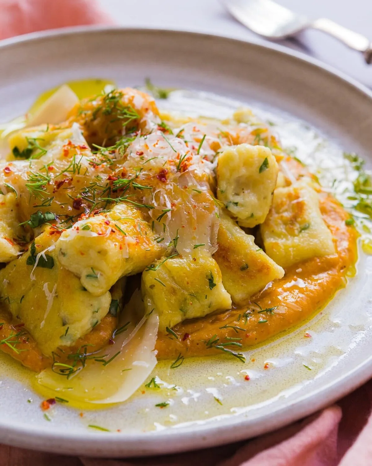 Close-up of pasta coated in a creamy sauce.